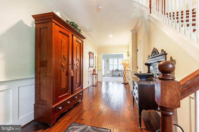 foyer entrance featuring dark hardwood / wood-style floors and ornamental molding