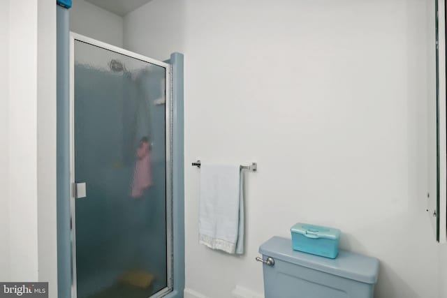 bathroom with toilet and walk in shower