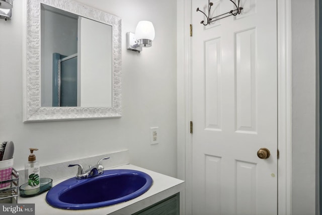 bathroom with walk in shower, vanity, and a chandelier