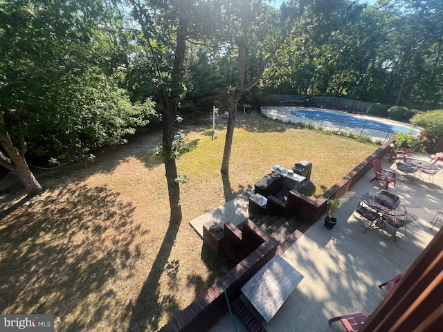 view of yard with a patio area and a covered pool