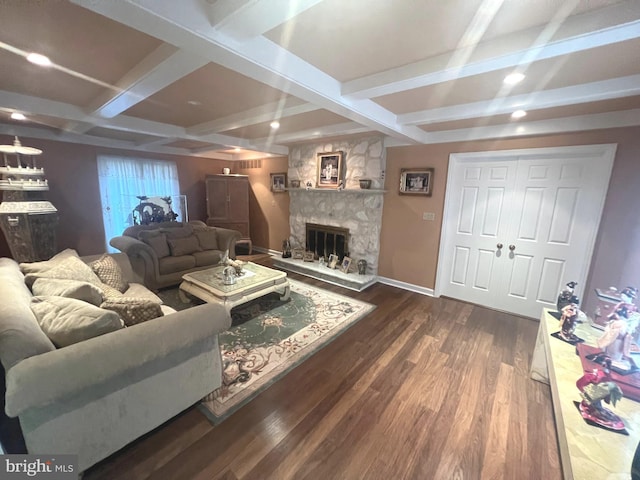 living room with dark wood-type flooring, a fireplace, beamed ceiling, and coffered ceiling