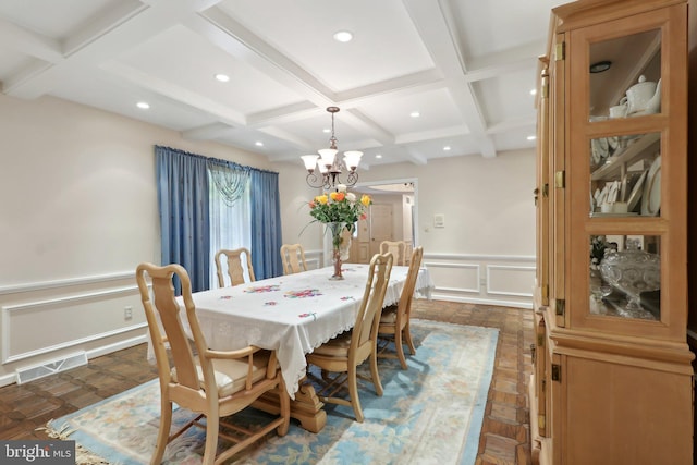 dining room with coffered ceiling, beamed ceiling, dark parquet floors, and a notable chandelier