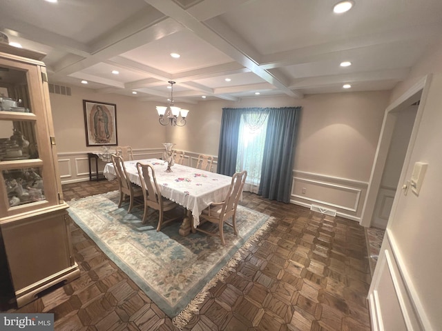 dining room with beam ceiling, dark parquet floors, an inviting chandelier, and coffered ceiling