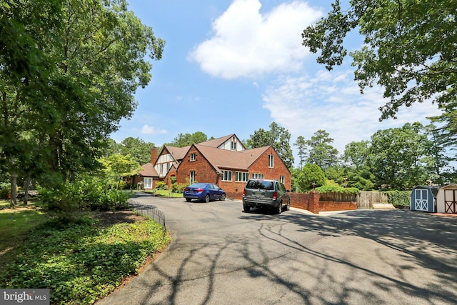 view of front of house featuring a shed