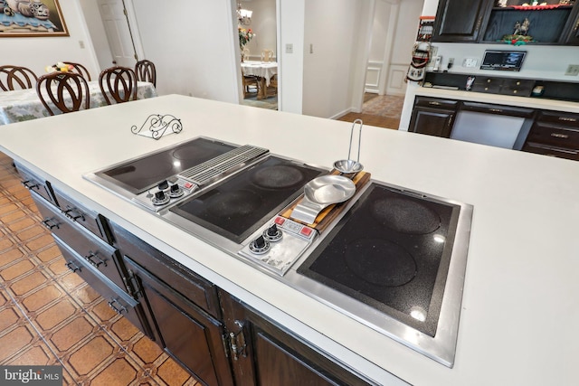 kitchen featuring dark brown cabinetry