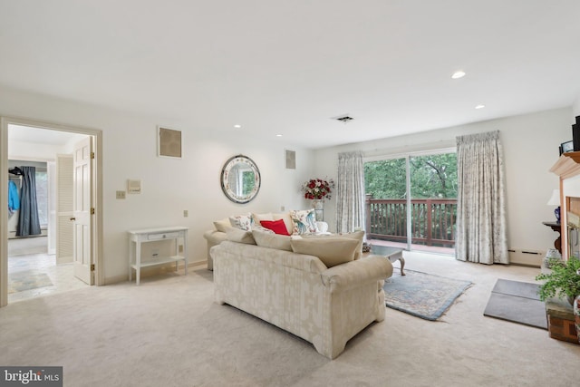 carpeted living room featuring baseboard heating