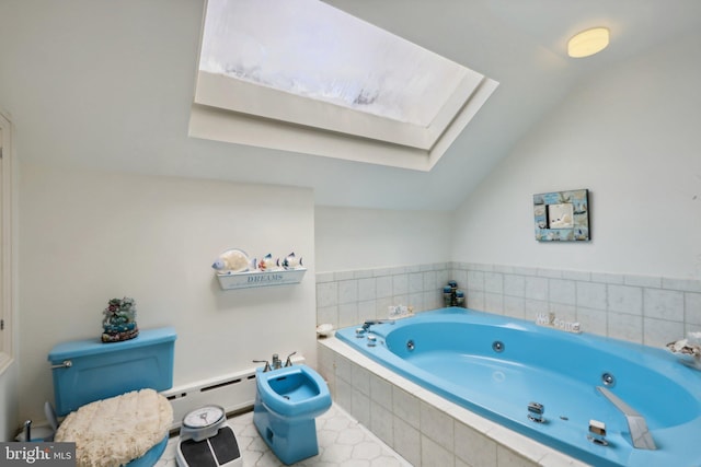 bathroom with a bidet, a baseboard heating unit, tile patterned floors, and lofted ceiling with skylight