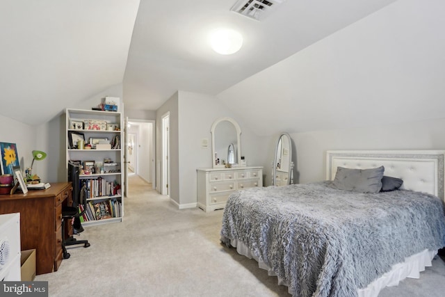 carpeted bedroom featuring vaulted ceiling