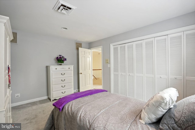 carpeted bedroom with a closet