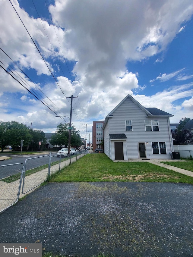 view of home's exterior featuring a lawn