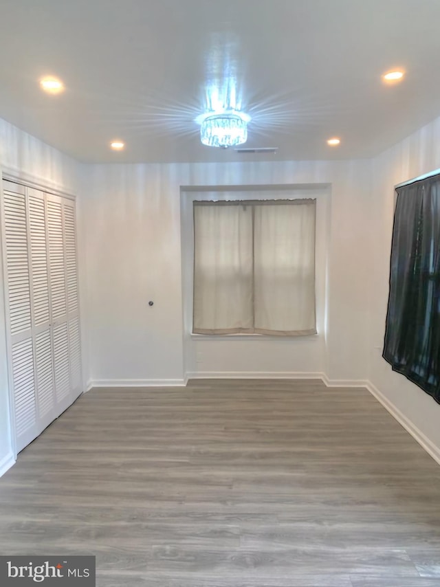 unfurnished bedroom featuring hardwood / wood-style floors