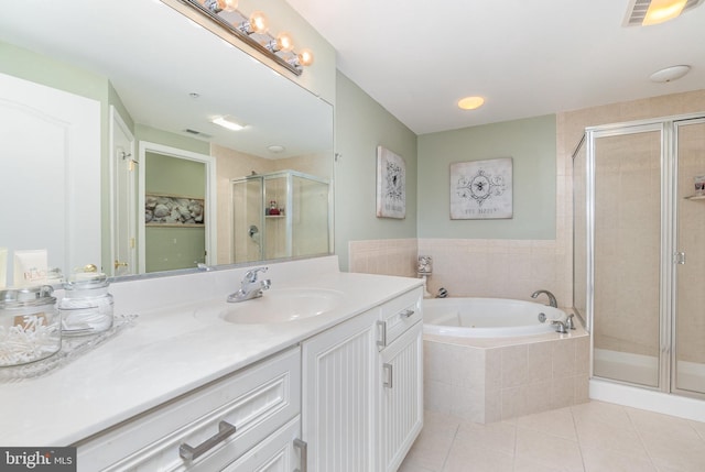 bathroom with vanity, tile patterned flooring, and independent shower and bath