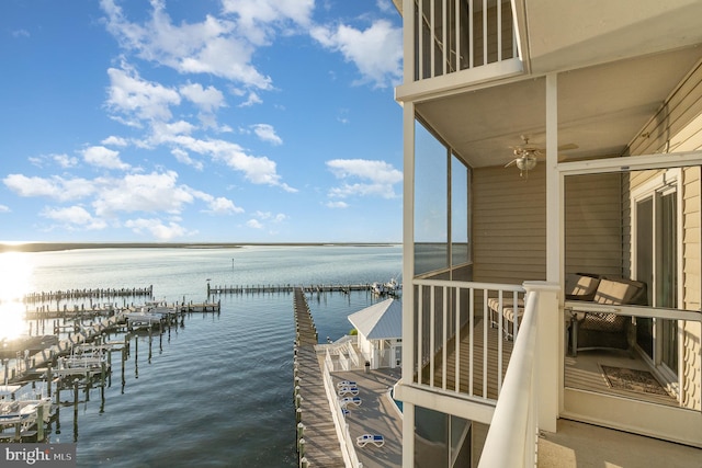 exterior space featuring a dock and a water view