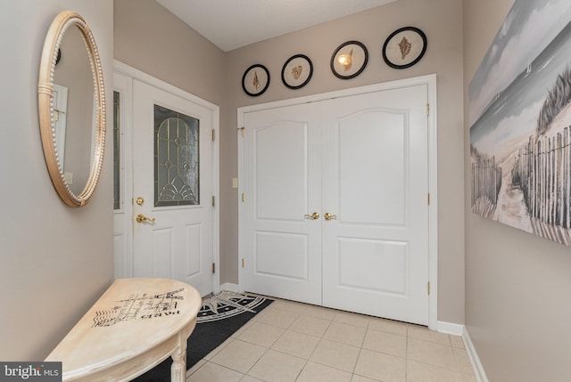 foyer with light tile patterned floors