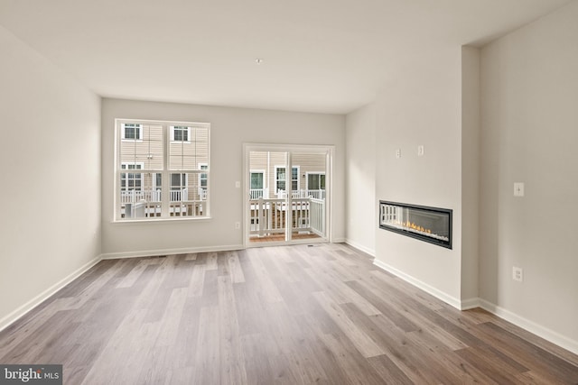 unfurnished living room with light hardwood / wood-style floors