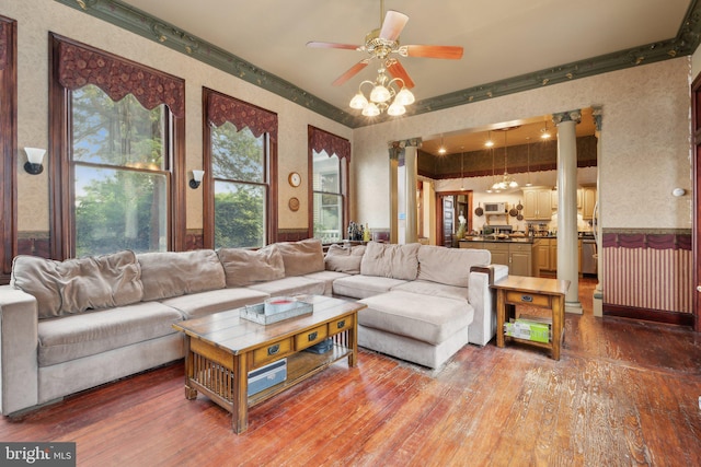 living room featuring ceiling fan and wood-type flooring