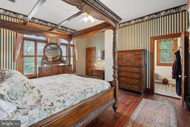 bedroom with ceiling fan and dark hardwood / wood-style flooring