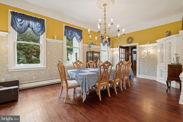 dining room featuring a chandelier, dark hardwood / wood-style floors, and a baseboard heating unit