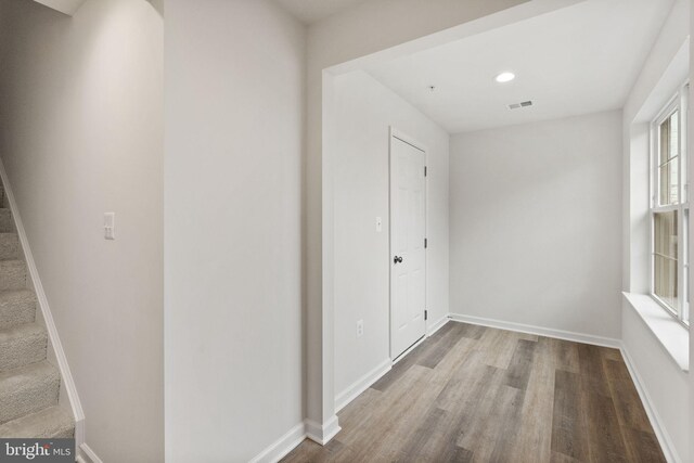 unfurnished room with hardwood / wood-style floors