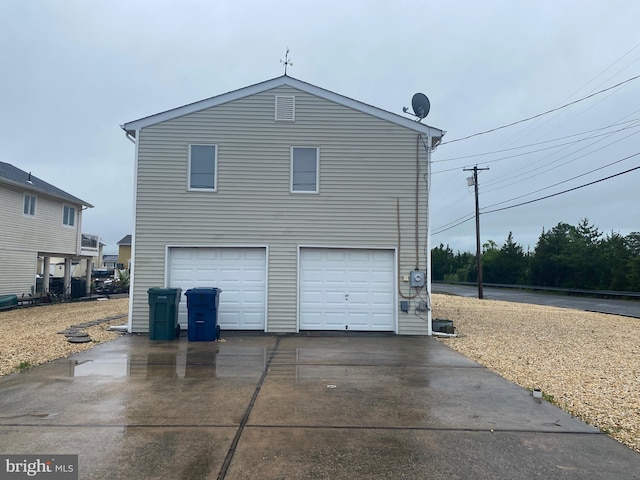 exterior space with driveway and a garage