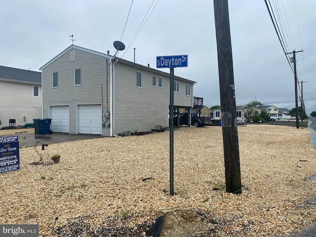 view of side of property with a garage