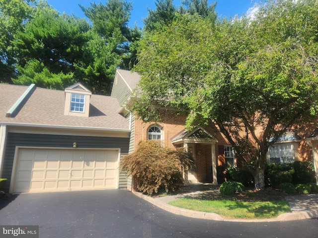 view of front of property with a garage