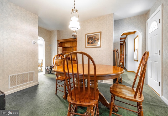 view of carpeted dining area