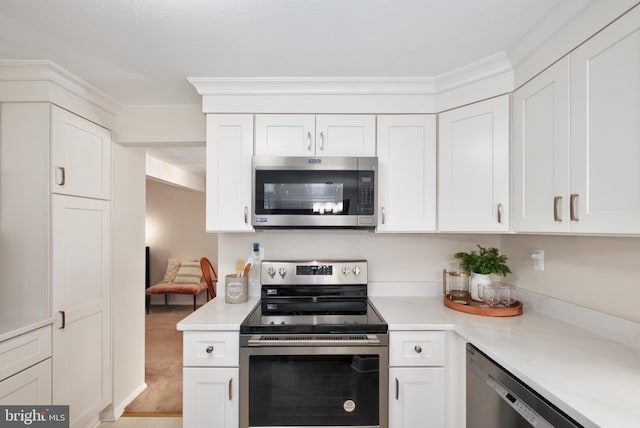 10712 Freds Oak Ct, Burke, VA 22015 - kitchen with stainless steel appliances, light countertops, and white cabinets