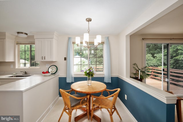 10712 Freds Oak Ct, Burke, VA 22015 - dining space featuring a chandelier and baseboards