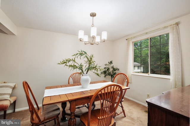 10712 Freds Oak Ct, Burke, VA 22015 - dining area featuring a chandelier, baseboards, and light carpet