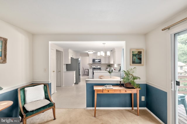 10712 Freds Oak Ct, Burke, VA 22015 - interior space featuring appliances with stainless steel finishes, white cabinets, light countertops, pendant lighting, and baseboards