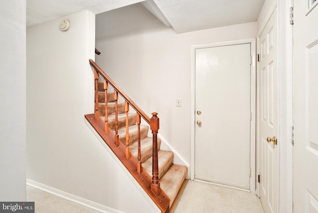 10712 Freds Oak Ct, Burke, VA 22015 - stairs featuring baseboards and tile patterned floors