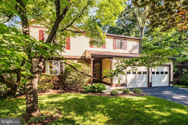 10712 Freds Oak Ct, Burke, VA 22015 - view of front of home with asphalt driveway and a front lawn