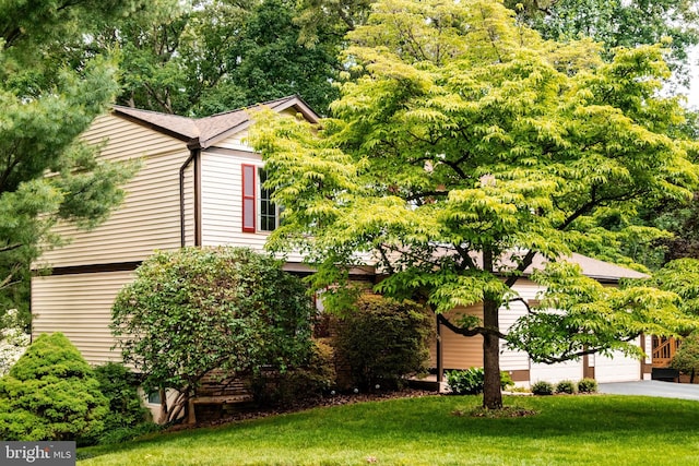 10712 Freds Oak Ct, Burke, VA 22015 - view of side of home with a yard, asphalt driveway, and an attached garage