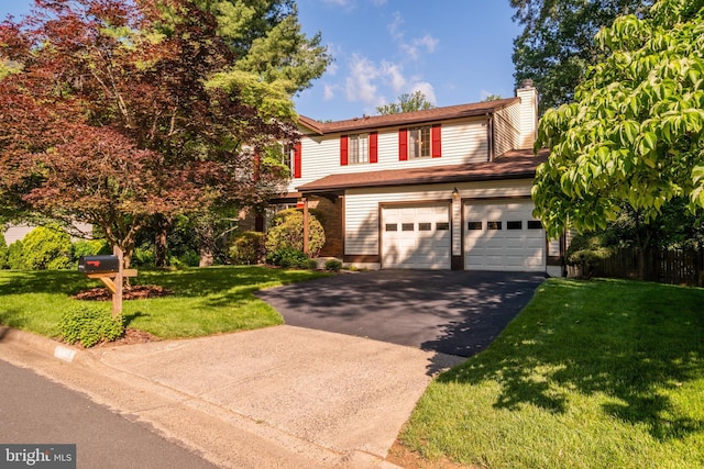 10712 Freds Oak Ct, Burke, VA 22015 - view of front facade featuring asphalt driveway, a front yard, a chimney, and a garage