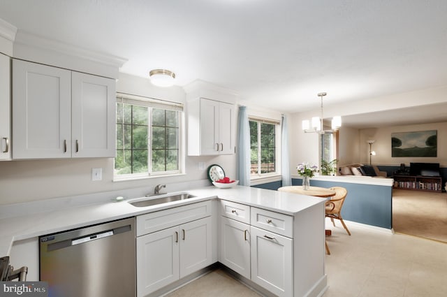 10712 Freds Oak Ct, Burke, VA 22015 - kitchen featuring dishwasher, a sink, light countertops, and a peninsula