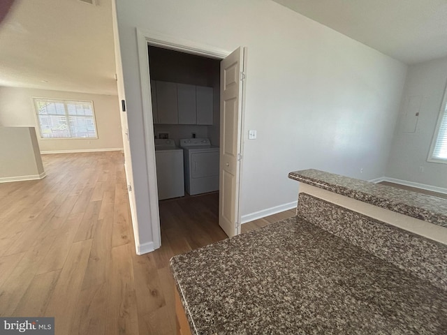 hall featuring washer and clothes dryer and hardwood / wood-style floors