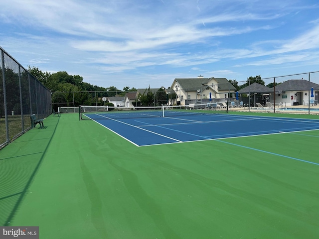 view of tennis court with basketball court