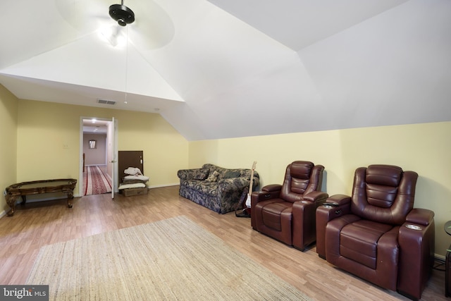 interior space featuring light wood-type flooring and lofted ceiling