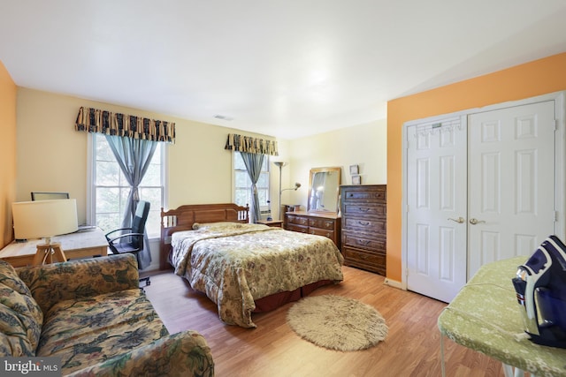 bedroom featuring a closet and light wood-type flooring