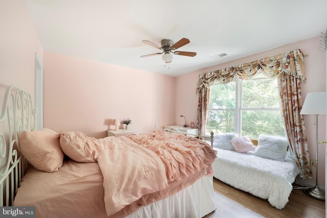 bedroom featuring ceiling fan and wood-type flooring