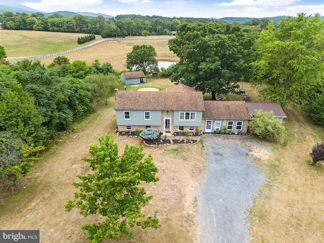 birds eye view of property with a mountain view