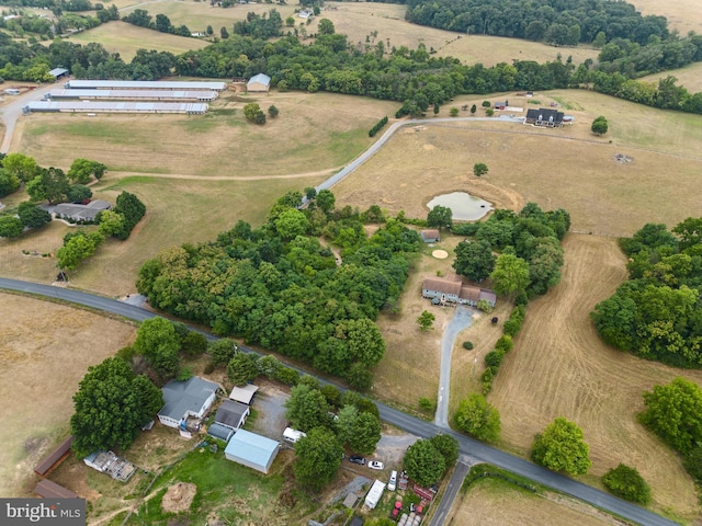 birds eye view of property featuring a rural view