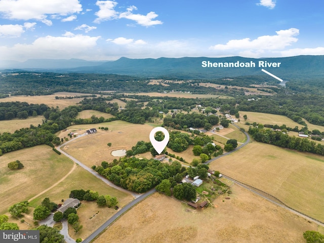 birds eye view of property with a mountain view