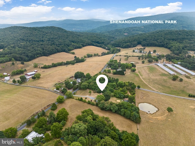 drone / aerial view with a mountain view and a rural view