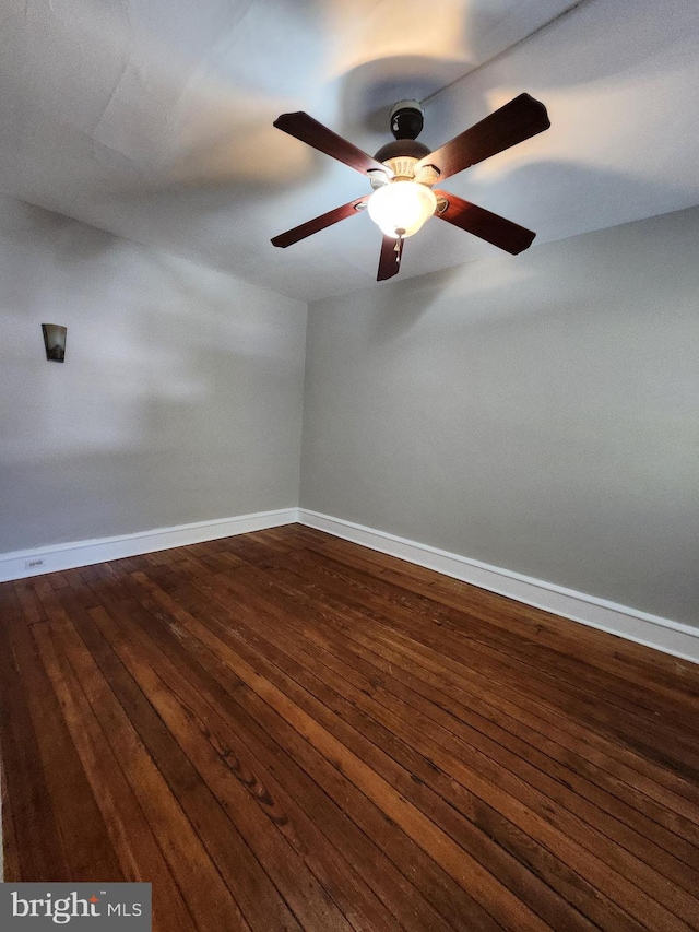 unfurnished room with ceiling fan and hardwood / wood-style flooring