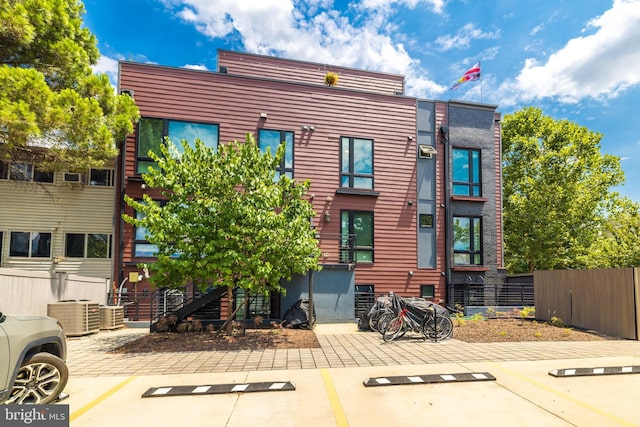 exterior space featuring cooling unit and a patio