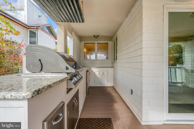 view of patio featuring area for grilling and exterior kitchen