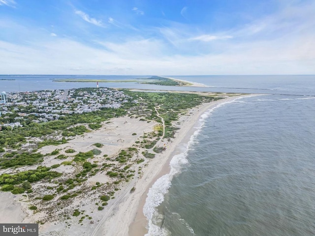 drone / aerial view with a view of the beach and a water view