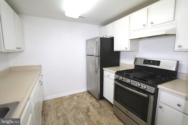 kitchen with appliances with stainless steel finishes, sink, and white cabinets